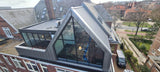 Grote dakopbouw in Den Haag aan de Nieuwe Parklaan-Sensbouw-dakopbouw,glazen gevel,maatwerk bouw,moderne architectuur,renovatie,woning uitbreiding,zakelijk-Moderne dakopbouw met glazen gevel-OBLY