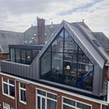 Grote dakopbouw in Den Haag aan de Nieuwe Parklaan-Sensbouw-dakopbouw,glazen gevel,maatwerk bouw,moderne architectuur,renovatie,woning uitbreiding,zakelijk-Moderne dakopbouw met glazen gevel-OBLY