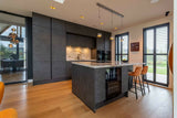 Luxe Leefkeuken-Iemms keukens & interieur-woonkamer-Luxe Leefkeuken met Betonlook, Wijnbar en Dekton Werkblad-OBLY