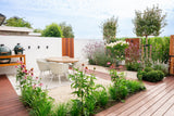 Sfeervolle designtuin met tuinkamer en buitenkeuken-Leonardus buiten-bamboevlonder tuin,big green egg tuin,designtuin den haag,glazen schuifwanden,luxe buitenleven,luxe tuinkamer,moderne stadstuin,tuin,tuinontwerp den haag-Moderne tuin met tuinkamer en glazen schuifwanden-OBLY