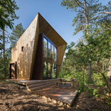 Stoer houten boshuis onder de bomen-Brandvries-exterieur-Boshuis Solo – Uniek boshuisje op Vlieland | BRANDVRIES-OBLY