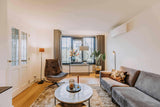 Warme woonkamer met oranje accenten-VAN WOLFSWINKEL WONEN-Woonkamer-Warme woonkamer met oranje accenten-OBLY