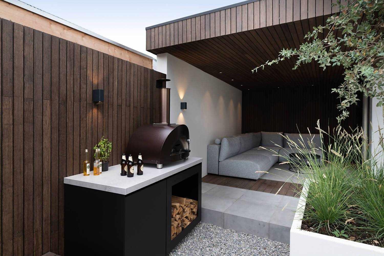 2 luxueuze buitenkeuken-elementen-COOXS-buitenkeuken met pizzaoven,Dekton buitenkeuken werkblad,design buitenkeuken met Big Green Egg,exclusieve wellness tuin,Exterieur,Keuken,luxe buitenkeuken met zwembad,moderne buitenkeuken inspiratie,stijlvolle buitenruimte met buitenkeuken,strakke tuin met buitenverblijf-OBLY