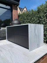 Design buitenkeuken natuurstenen werkblad-COOXS-alle,buiten koken in luxe tuin,buitenkeuken met natuurstenen werkblad,compacte buitenkeuken met barbecue,design buitenkeuken,exclusieve buitenruimte,luxe tuin met buitenkeuken,moderne buitenkeuken inspiratie,strakke wellness tuin-Design buitenkeuken natuurstenen werkblad-OBLY