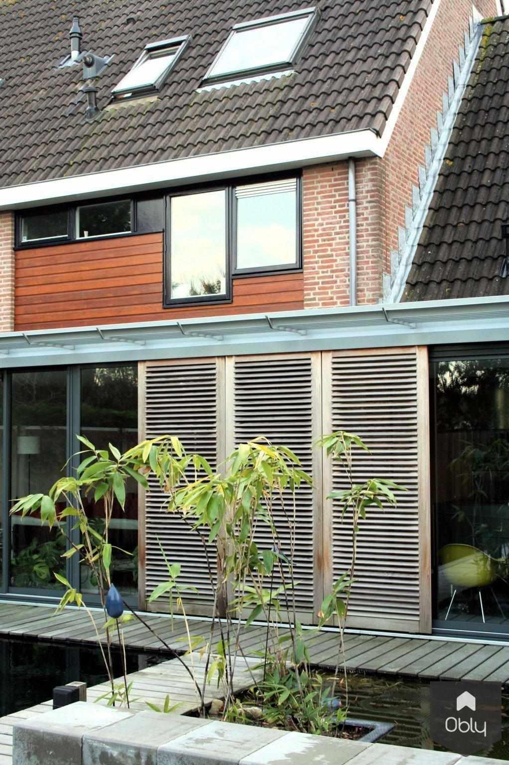 Uitbouw woonhuis Vogelenzang-Paul Seuntjens Architectuur + Interieur-Aanbouw,alle,Exterieur,jaren 70 woning,schuifpuien,uitbouw,vijver,zonoriëntatie-OBLY