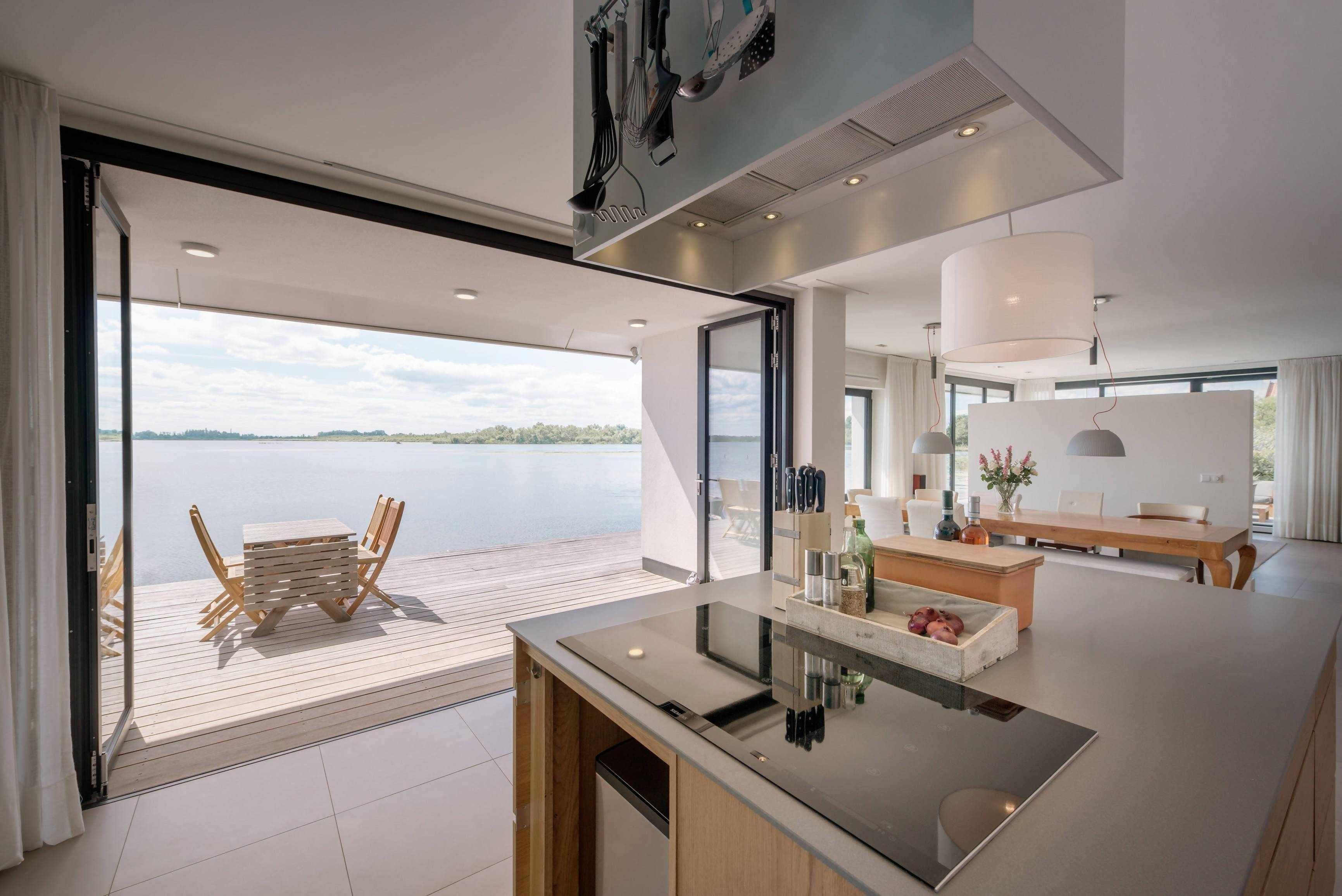 Vouwwanden tuinkamer-Goes serres-glazen serre,keuken,moderne serre,serre,serre aan het water,serre aanbouw,serre woning-Vouwwanden tuinkamer Goes serres-OBLY