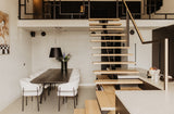 Luxe loft in oude textielfabriek met maatwerk keuken en designtrap