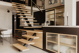 Luxe loft in oude textielfabriek met maatwerk keuken en designtrap