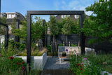 Een moderne tuin als verlengstuk van de woning-Leonardus buiten-architectonische tuin,luxe stadstuin,maatwerk plantenbakken,moderne nieuwbouwtuin,moderne pergola,moderne tuin inspiratie,rijke beplanting tuin,siergrassen tuin,tuin,tuin met meerdere zitplekken,zwarte pergola tuin-Moderne nieuwbouwtuin met pergola en beplanting-OBLY