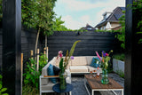 Een moderne tuin als verlengstuk van de woning-Leonardus buiten-architectonische tuin,luxe stadstuin,maatwerk plantenbakken,moderne nieuwbouwtuin,moderne pergola,moderne tuin inspiratie,rijke beplanting tuin,siergrassen tuin,tuin,tuin met meerdere zitplekken,zwarte pergola tuin-Moderne nieuwbouwtuin met pergola en beplanting-OBLY