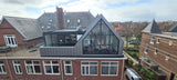 Grote dakopbouw in Den Haag aan de Nieuwe Parklaan-Sensbouw-dakopbouw,glazen gevel,maatwerk bouw,moderne architectuur,renovatie,woning uitbreiding,zakelijk-Moderne dakopbouw met glazen gevel-OBLY