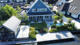 Hamptons tuin met modern zwembad en strakke belijning-The Green Fix-design tuin,exclusieve tuin,Hamptons stijl,Hamptons tuin,houten vlonder,luxe buitenleven,luxe tuin,moderne buitenruimte,natuurlijke beplanting,strakke tuin,The Green Fix,tuin met zwembad,zwembad tuin-OBLY