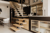 Luxe loft in oude textielfabriek met maatwerk keuken en designtrap