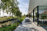 Moderne woning in Bergen op Zoom met glazen schuifpuien-KELLER minimal windows® by Kumasol-aluminium kozijnen,binnen buiten wonen,Exterieur,Glasdesign,glasspecialist,glazen schuifpui,luxe woning,moderne architectuur,moderne villa,open leefruimte,veel daglicht,villa met zwembad-Moderne woning Bergen op Zoom met glazen schuifpui-OBLY