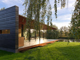 Moderne woning in Hilversum met grote glazen gevels-KELLER minimal windows® by Kumasol-aluminium kozijnen,binnen buiten verbinding,Exterieur,Glasspecialist,glazen gevel,luxe woning,moderne villa hilversum,open leefruimte,strakke architectuur,veel daglicht,villa aan het water-Moderne woning Hilversum met glazen gevel | KELLER-OBLY