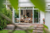 Serre Aanbouw Optimaal Genieten van Licht en Ruimte-Busscher Serrebouw-binnen buiten wonen,glazen serre,Serre,serre aan woning,serre aanbouw,serre met glasdak-Serre Aanbouw in Den Haag: Optimaal Genieten van Licht en Ruimte-OBLY