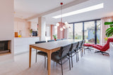 Slimme maatwerkoplossingen in een moderne gezinswoning-oker&goud-boekenkast op maat,kleur- en materiaaladvies,modern interieur,moderne woning,open leefruimte,terrazzo,trapmeubel,woonkeuken-Moderne gezinswoning met maatwerk interieur | OKER&GOUD-OBLY