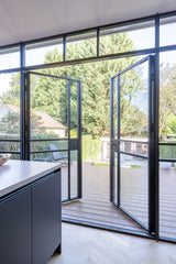 Verbouwing met aanbouw in Hillegersberg-Sensbouw-Luxe keuken design,Stalen puien interieur,Veel daglicht woning,Visgraat vloer interieur,Woonkamer met tuin verbinding-Verbouwing met moderne aanbouw-OBLY