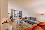 Warme woonkamer met oranje accenten-VAN WOLFSWINKEL WONEN-Woonkamer-Warme woonkamer met oranje accenten-OBLY