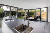 Aanbouw met glazen vouwwand-Busscher Serrebouw-Aanbouw,alle,Tuinen,Woonkamer-Aanbouw met glazen vouwwand | OBLY.com-OBLY