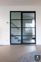 Betonlook vloer met stalen deuren-Willem Designvloeren B.V.-alle, Woonkamer-Betonlook vloer met stalen deuren | OBLY.com-OBLY
