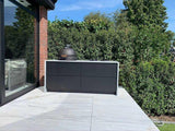 Design buitenkeuken natuurstenen werkblad-COOXS-alle,buiten koken in luxe tuin,buitenkeuken met natuurstenen werkblad,compacte buitenkeuken met barbecue,design buitenkeuken,exclusieve buitenruimte,luxe tuin met buitenkeuken,moderne buitenkeuken inspiratie,strakke wellness tuin-Design buitenkeuken natuurstenen werkblad-OBLY