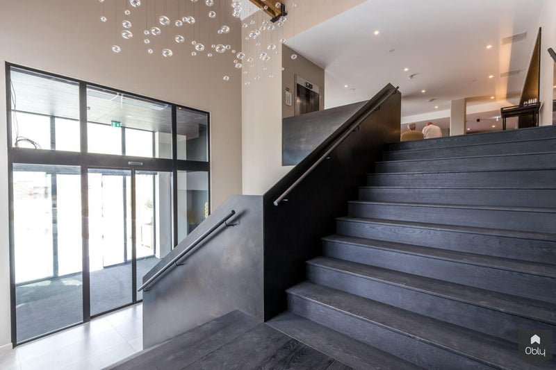 Elegante eiken en stalen trap-Van Bruchem Staircases-alle,Entree hal trap-OBLY