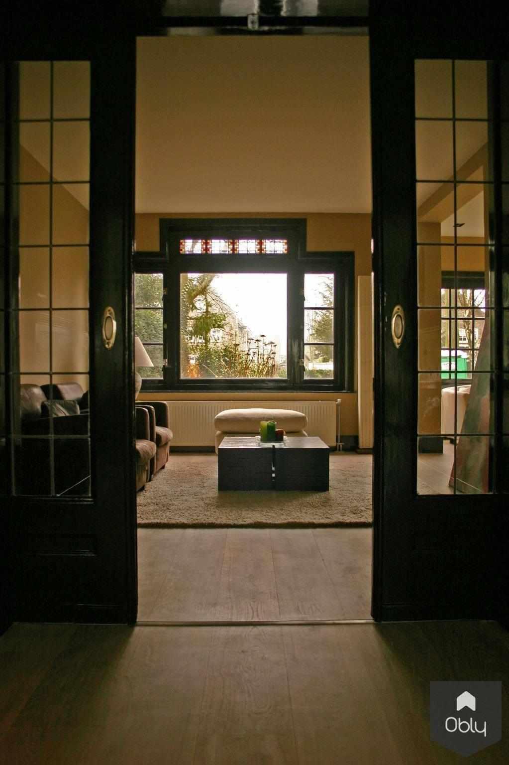 Jaren 20 woning Laren-Suzanne-Holtz-Studio-alle,exclusieve villa inrichting,jaren 20 woning Laren,karakteristieke jaren 20 details,luxe woonkamer interieur,moderne open leefruimte,sfeervolle interieur verlichting,stijlvolle woonkeuken inspiratie,warme houten accenten,Woonkamer-OBLY