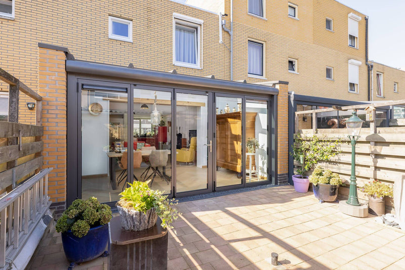Serre aanbouw met vouwwand en lessenaarsdak-Busscher Serrebouw-Aanbouw,alle,Tuinen,Woonkamer-Serre aanbouw met vouwwand en lessenaarsdak | OBLY.com-OBLY