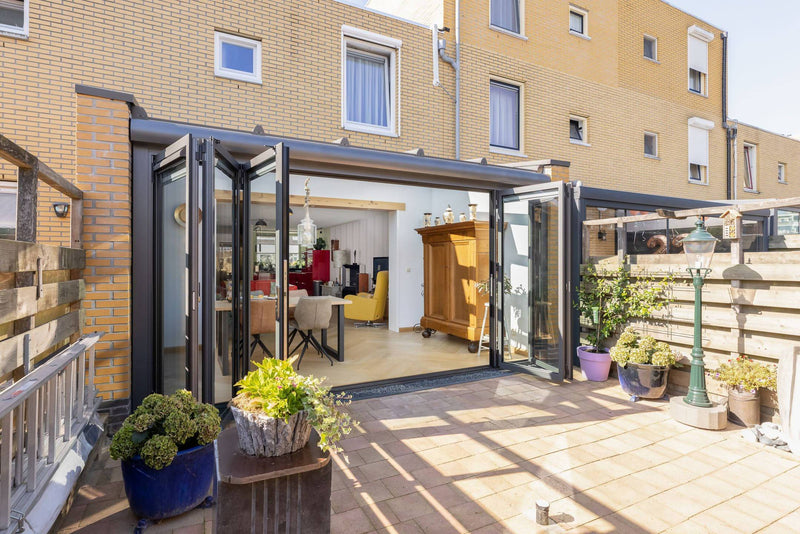 Serre aanbouw met vouwwand en lessenaarsdak-Busscher Serrebouw-Aanbouw,alle,Tuinen,Woonkamer-Serre aanbouw met vouwwand en lessenaarsdak | OBLY.com-OBLY