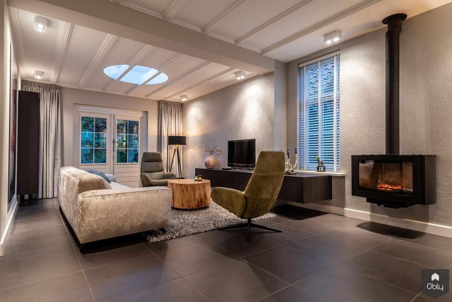 Stijlvolle jaren 30 woning met stalen deuren en haard-Kroekenstoel Excellence Design-alle,jaren 30 woning,luxe woonkamer,moderne haard,stalen deuren,stijlvolle leefruimte,tijdloos interieur,warm interieur,Woonkamer-OBLY