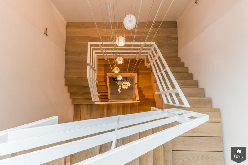 Trappen met stalen middenboom-Van Bruchem Staircases-alle,Entree hal trap-OBLY