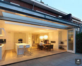Uitbreiding jaren ’30 woning met open leefruimte en veranda-Christel Smeets architect bna-Aanbouw,alle,exterieur jaren 30 woning aanbouw,exterieur veranda jaren 30 huis,interieur open woonruimte vloer,jaren 30 woning,keuken moderne aanbouw keuken,woonkamer interieur uitbreiding woning-Jaren ’30 woning uitbreiden met veranda en leefkeuken-OBLY