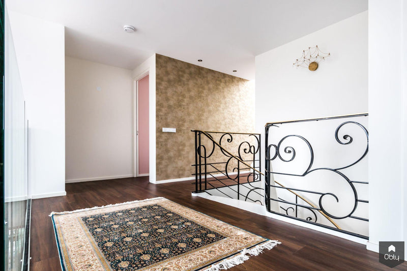 Wenteltrap met siersmeedwerk-Van Bruchem Staircases-alle,Entree hal trap-OBLY