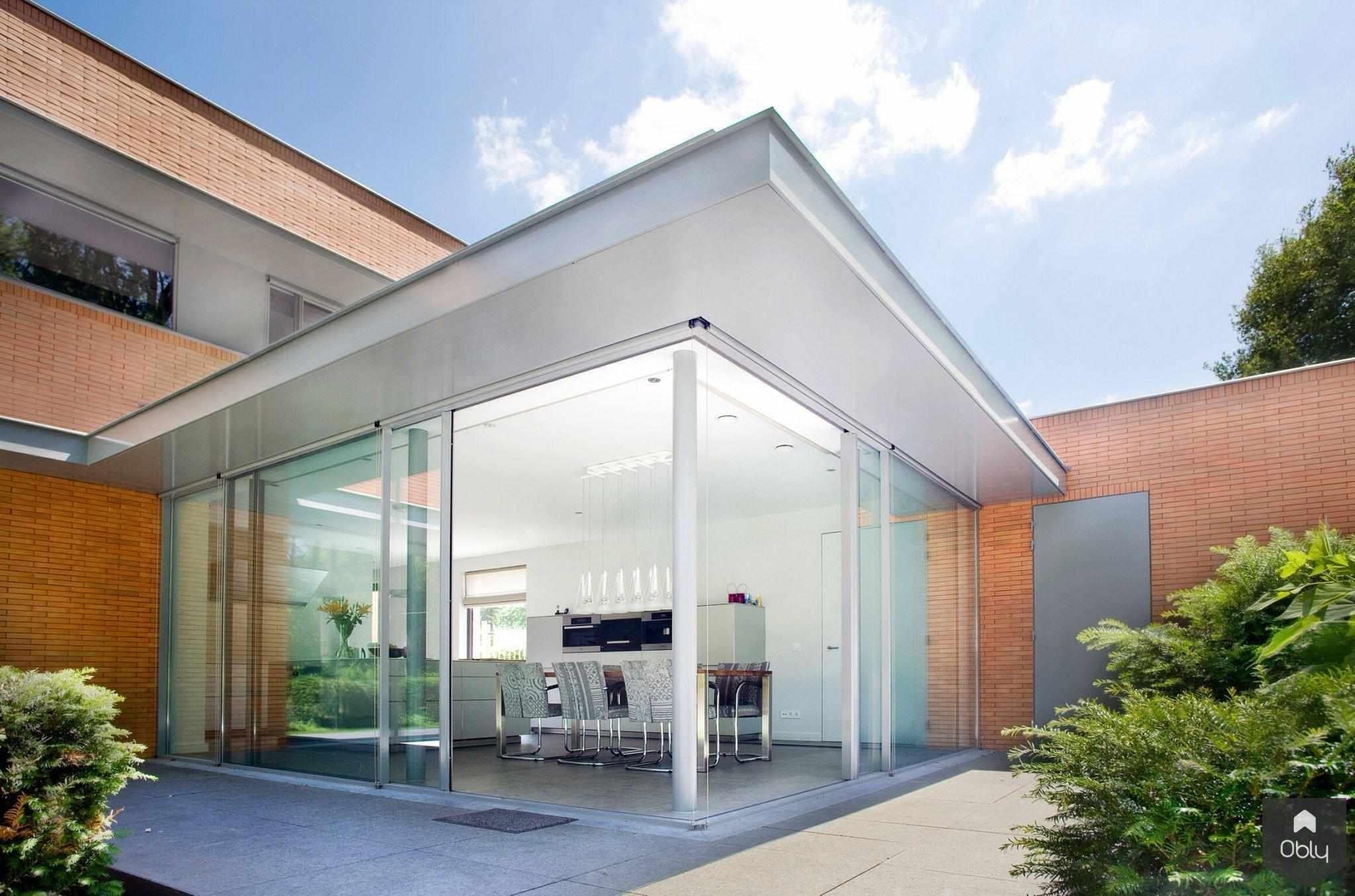 Woonhuis De B. Goirle-KELLER minimal windows® by Kumasol-alle,aluminium kozijnen,binnen buiten verbinding,design woning,Exterieur,grote glaspartijen,luxe villa,minimalistische ramen,moderne woning glas,openslaande hoekpui,schuifpuien woning,Woonkamer-OBLY